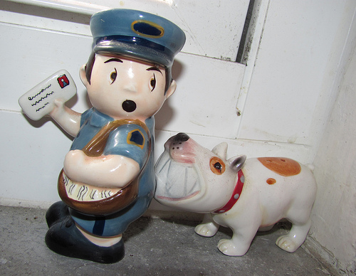 postman and dog salt and pepper shaker design