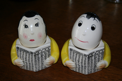 men reading salt and pepper shakers