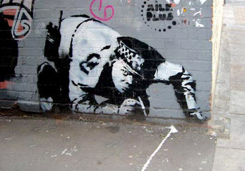 police officer graffiti banksy