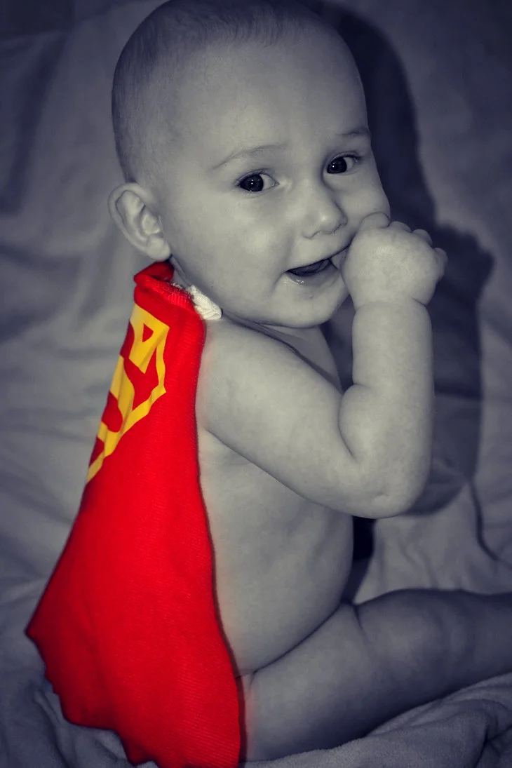 baby in superman cape