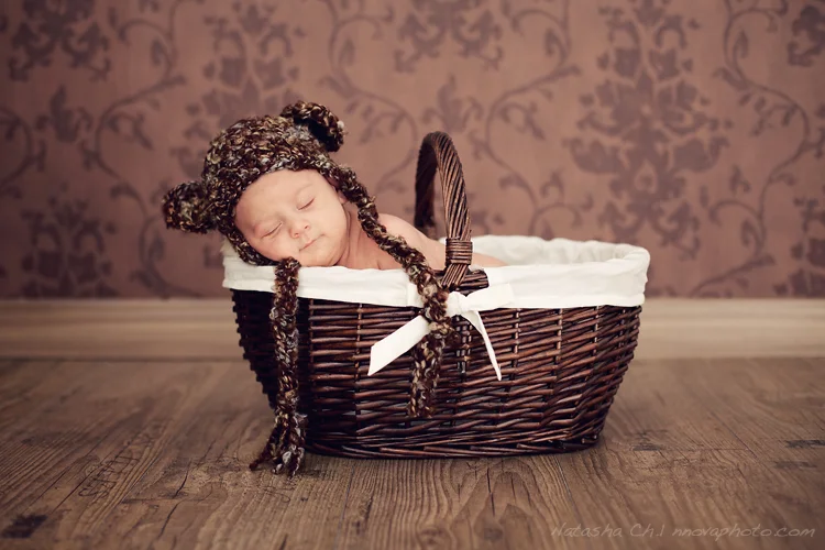 baby sleeping in a basket